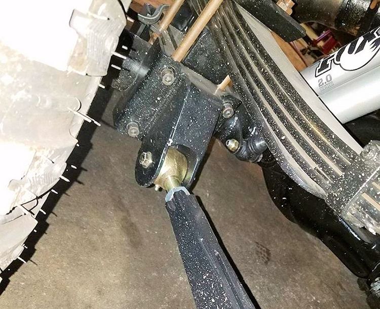 Dodge Off Road traction bar installed under the rear leaf spring of a Ram