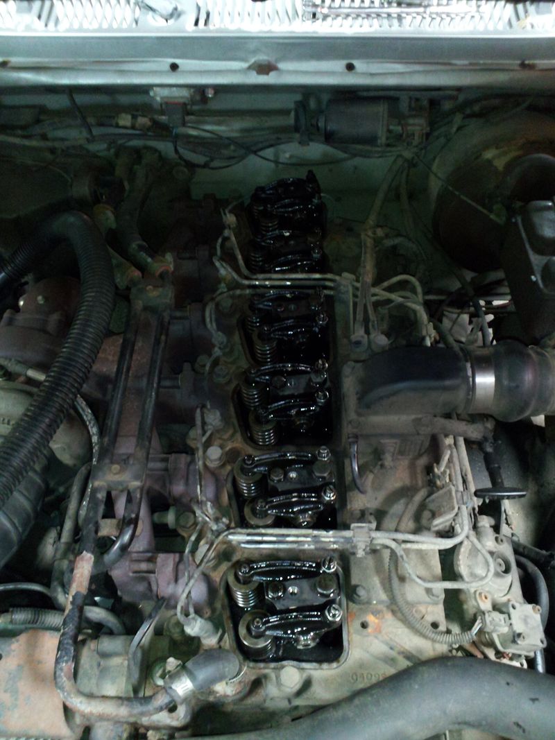 5.9L Cummins in a Dodge Ram with the valve cover off, showing the rocker arms